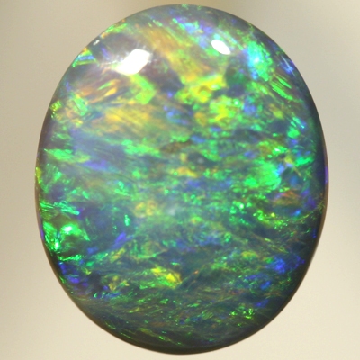 SOLID BLACK OPAL Bright orange and green over a blue background. SEE VIDEO